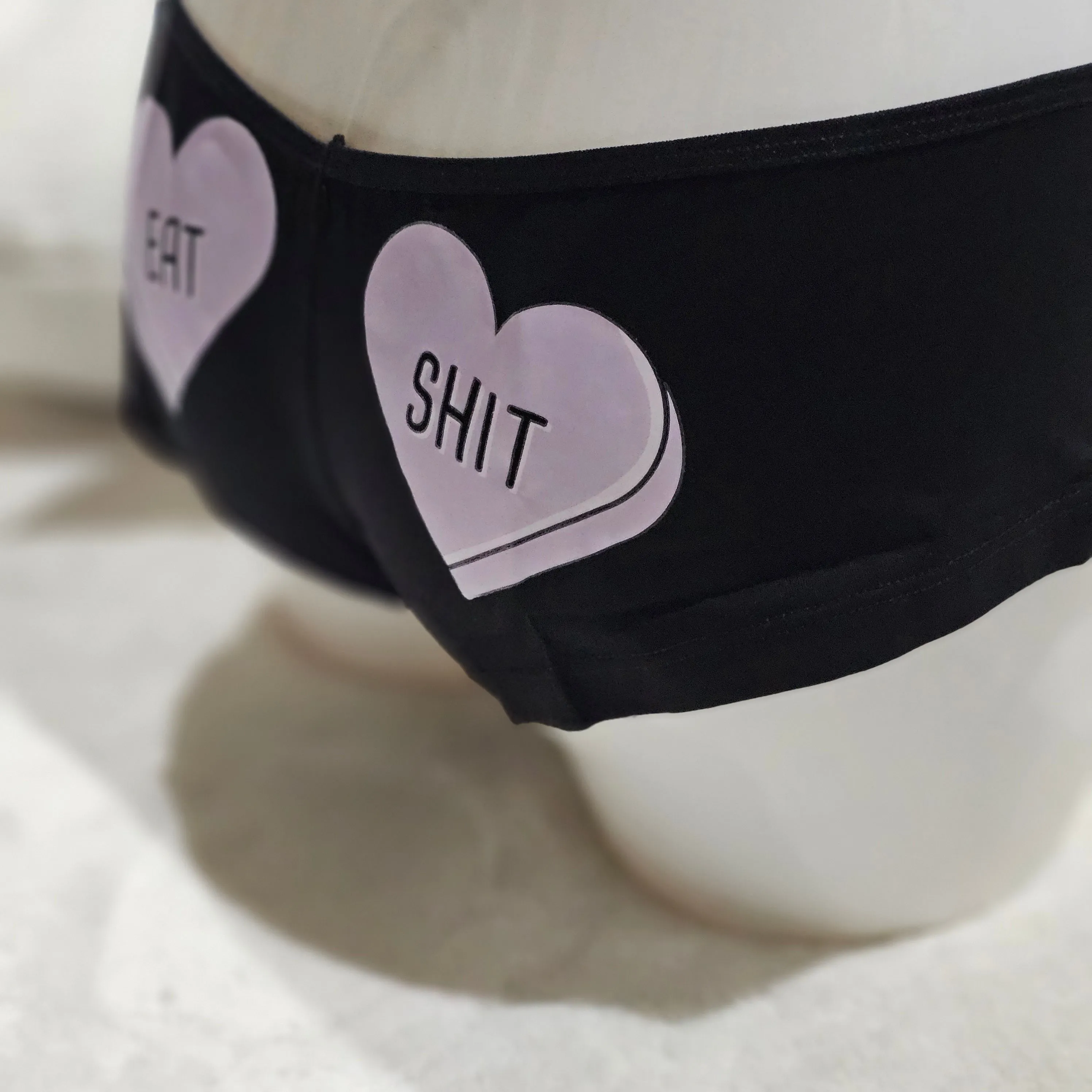 Eat Shit Boy Short Style | Black With Purple Hearts Graphic